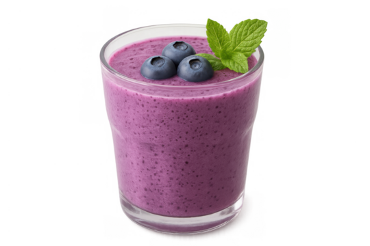 Blueberry smoothie in a glass with mint and fresh blueberries, preparing healthy and refreshing drinks