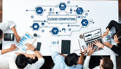 A diverse group of professionals collaborates around a table focused on cloud computing solutions, emphasizing data privacy, backup strategies, and big data management. Amity