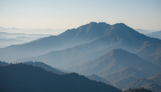 Layered mountains in hazy blue atmospheric distance - Powered by Adobe