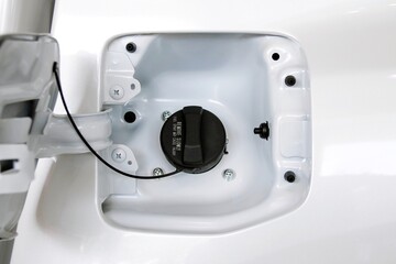 Fuel tank cap of white car