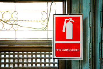 Fire extinguisher position sign beside the window
