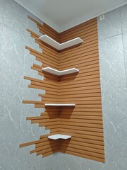 Light wood wall decoration with proper lighting, store some unique items to make it look more luxurious