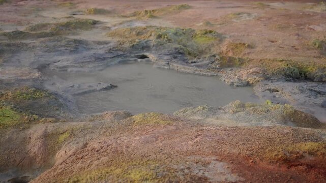 Mud pot, hot spring, fumarole in the landscape - north of Iceland