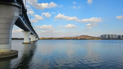 Seoul Hangang River Railway Bridge with Blue Sky and Clouds (푸른 하늘과 구름 아래 서울 한강의 철교)