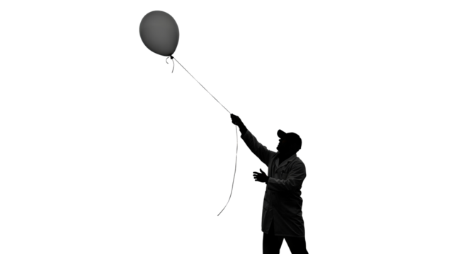 Man Holding Balloon on String Silhouette