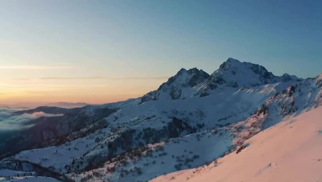 Majestic snowy mountain peaks illuminated by soft cold light creating dramatic natural winter landscape with serene untouched wilderness scene.