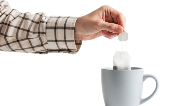 Hand placing tea bag into mug isolated on transparent background