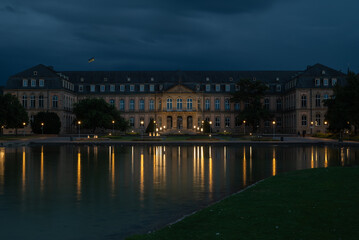 Fototapeta premium New Palace Stuttgart at Night with Lake Reflections