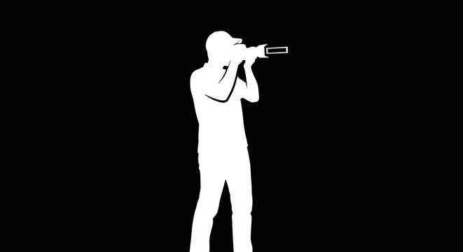 Silhouette of a person holding a camera and taking a picture against a black background.
