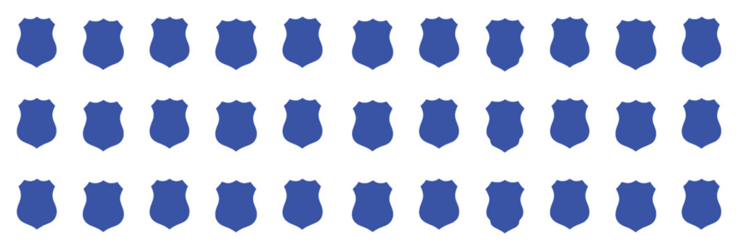 A seamless pattern of blue police badges on a white background