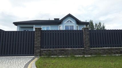 The big house is behind a fence