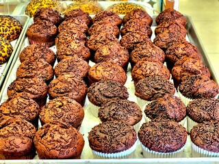Freshly Baked Chocolate Muffins Topped with Cocoa Sprinkles