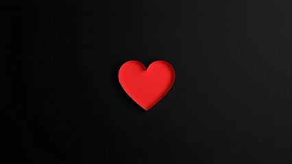 An abstract red heart shape on a matte black background, emphasizing minimalist design with negative space.