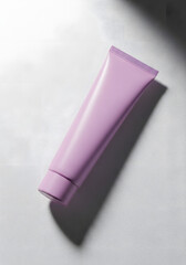 A minimalist studio shot of a single lavender-colored tube of cosmetic cream casting a long shadow.