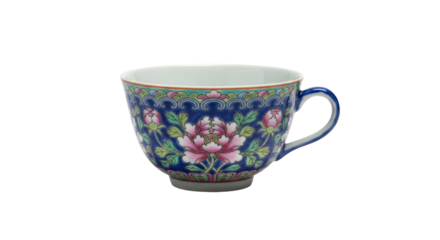 Ornate porcelain teacup with floral patterns and blue background