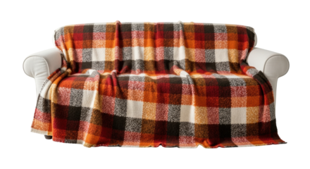 Cozy autumn plaid blanket draped over white sofa for warmth and comfort