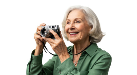 Smiling elderly caucasian woman with camera in green shirt capturing memories