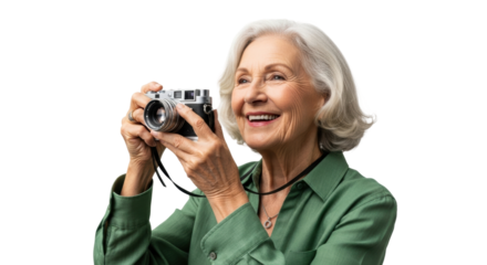 Smiling elderly caucasian woman with camera in green shirt capturing memories