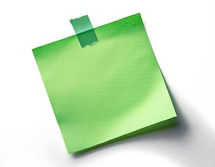 An isolated light green sticky note with tape on a white background