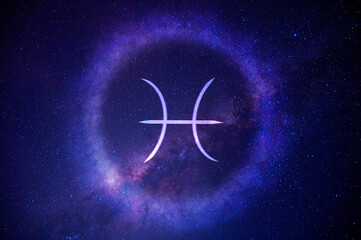 Pisces zodiac sign on a galaxy background © Sudarat