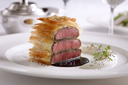 Indulge in a stunning beef wellington presentation, perfect for fine dining or a food blog, showcasing culinary artistry and gourmet excellence