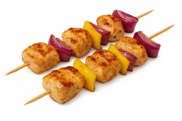 Chicken shish kebabs grilling with red onion and yellow bell pepper on skewers, perfect for barbecue food and appetizers