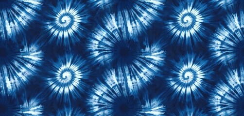 Abstract tie-dye pattern in shades of indigo blue. Repeating spiral design features white radial lines. Decorative design suitable for fabric fashion print wallpaper design textile.
