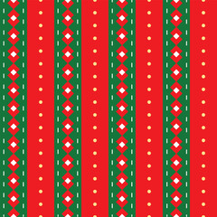 Seamless Christmas pattern featuring vertical red-green stripes, dotted accents, and geometric diamond shapes, creating a bold festive background ideal for holiday designs.