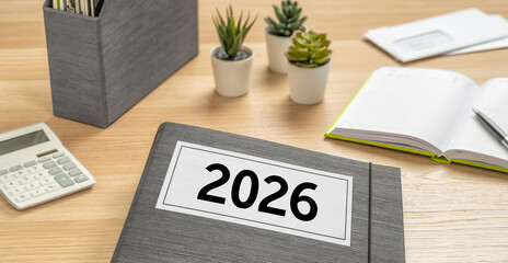 A folder on a desk with the label 2026