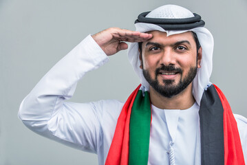 arab man wearing emirati clothing posing in studio - Handsome middle-eastern businessman portrait