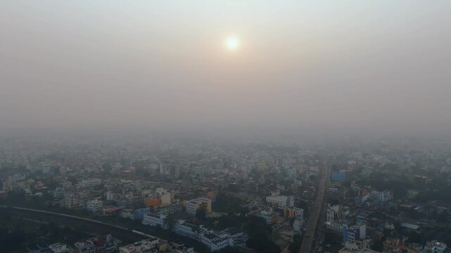 4k Aerial Drone View of Pale Sun Struggling Through Thick Toxic Smog and Haze Over Delhi. High AQI In Delhi.