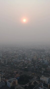 4k Aerial Drone View of Pale Sun Struggling Through Thick Toxic Smog and Haze Over Delhi. High AQI In Delhi.