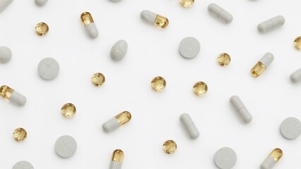 Colored pills and tablets scattered over white background, creating bright pharmaceutical backdrop