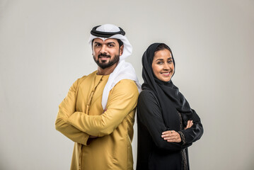 ARabian couple isolated on grey background