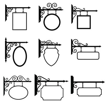 Collection of nine vintage-style hanging signs in black silhouette, featuring ornate wrought iron brackets with scrolls and various blank sign shapes like oval, circle, and shield