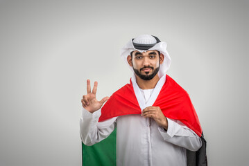 Arab man wearing emirati clothing posing in studio - Handsome middle-eastern businessman portrait
