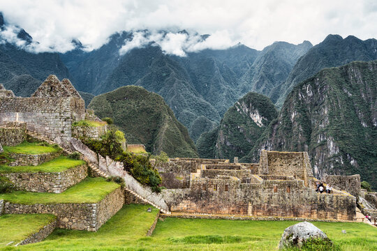 Dramatic beautiful scenic landscape with the Andes Mountains (Eastern Cordillera)and Machu Picchu inca stone walls and ruins, in Peru