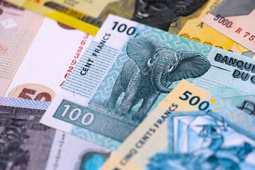 Fototapeta premium Congolese franc money bills in big amount on table close up. Rich life concept in Democratic Republic of Congo. Business and economy