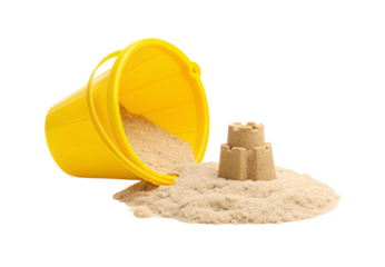 Yellow plastic pail lying sideways with sand and miniature castle, isolated on a transparent background