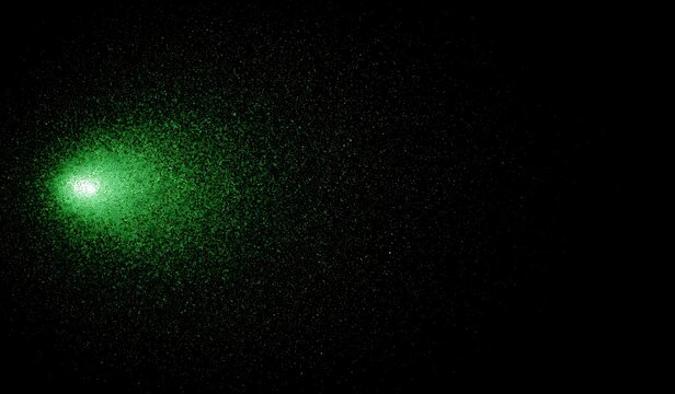 A mesmerizing display of green light particles dancing in the dark, creating a magical effect