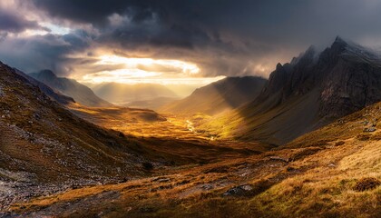 dramatic wide angle landscape of rugged mountains under stormy skies golden sunlight breaking through heavy clouds