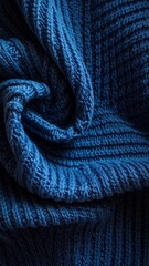 Close-up of a blue knitted fabric with visible texture