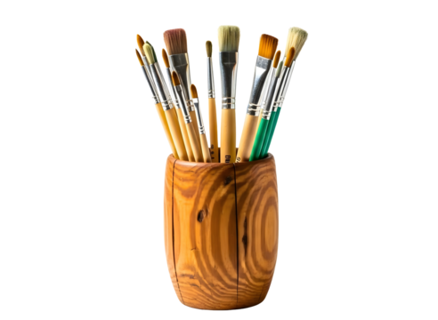 Assortment of paint brushes in a wooden holder isolated on transparent background