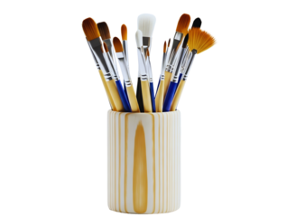 Assortment of paint brushes in a wooden holder isolated on transparent background