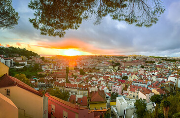 Beautiful sunset over Lisbon, Portugal, red rooftops, Tagus River