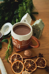 Christmas decorations for the home, Advent candles on a wreath, tree branches, a cup of hot cocoa. Winter holidays.
