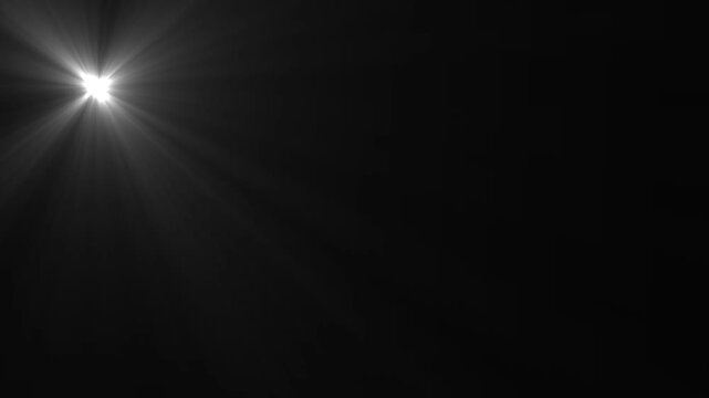 High-quality stock footage of sun rays light effects, for desi Optical Lens flare light background. White Lamp Rays Shining on Black Background,  sun rays or god bless rays' effect. white light ray .