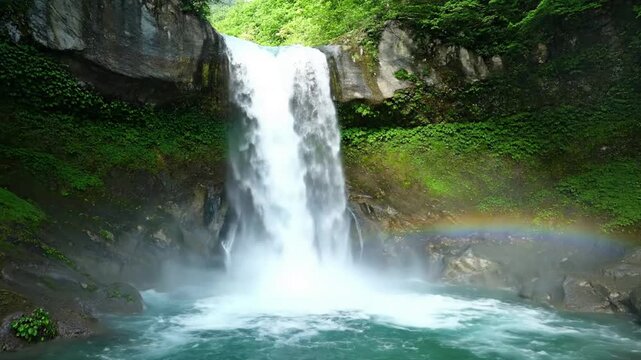 Detailed geological features of a waterfall, showcasing the erosion patterns, ancient rock strata, and unique formations carved by millennia of water flow.