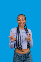 Young woman smiling and gesturing pointing in front