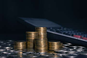 Pile of gold coins on black background